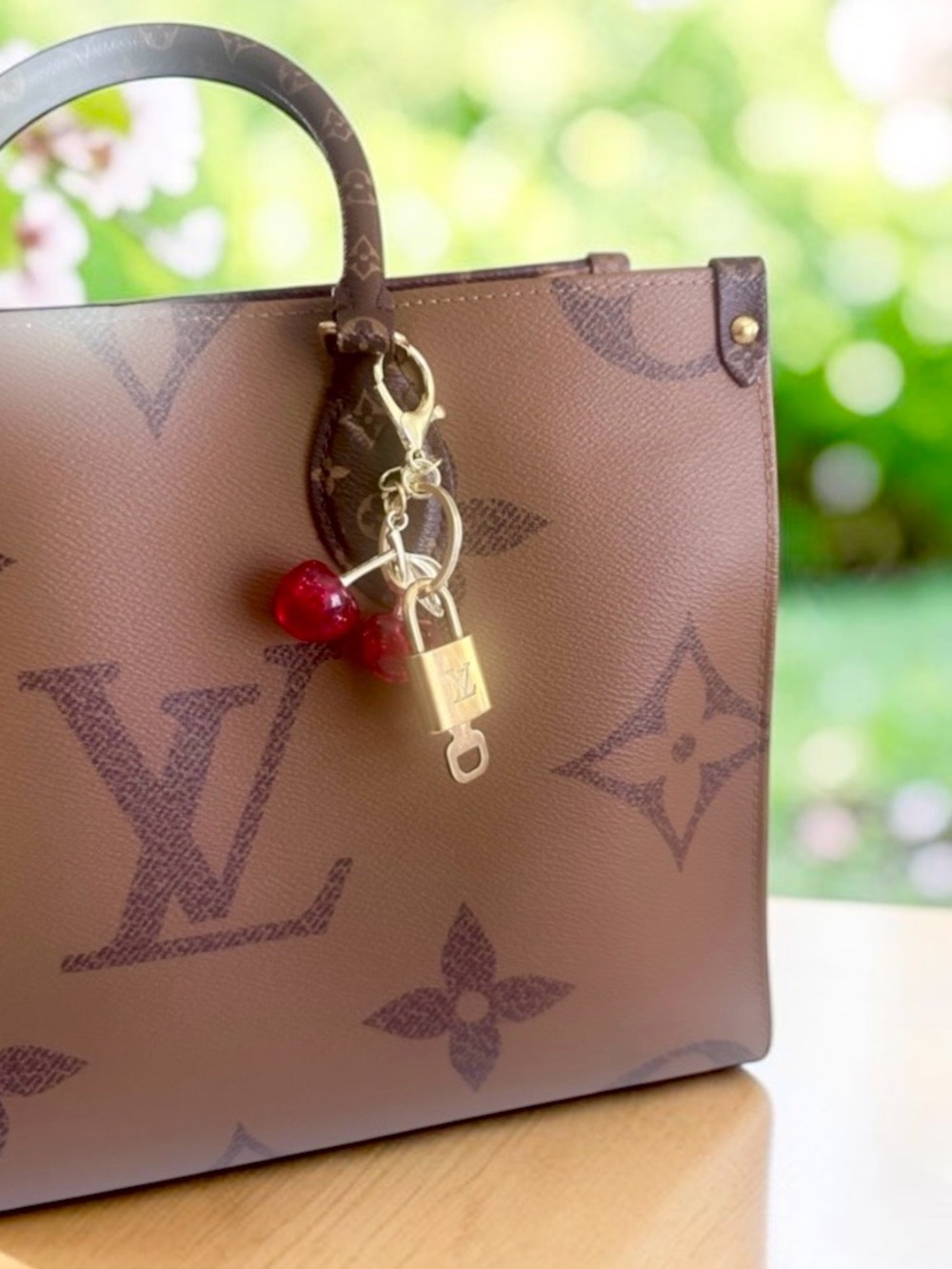 Authentic Louis Vuitton Padlock with  Cherry bag charm